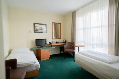 Ein Bett oder Betten in einem Zimmer der Unterkunft Trip Inn Hotel Dasing-Augsburg