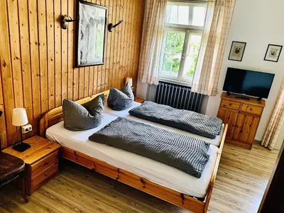 Ein Bett oder Betten in einem Zimmer der Unterkunft Gästehaus Hohe Tannen