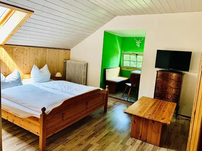 Ein Bett oder Betten in einem Zimmer der Unterkunft Gästehaus Hohe Tannen