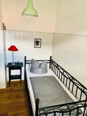 Ein Bett oder Betten in einem Zimmer der Unterkunft Gästehaus Hohe Tannen