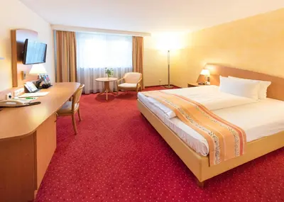 Ein Bett oder Betten in einem Zimmer der Unterkunft Hotel Alarun Munich by Mayburgh