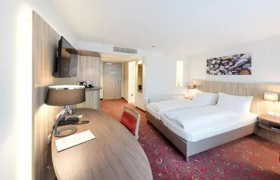 Ein Bett oder Betten in einem Zimmer der Unterkunft Hotel Alarun Munich by Mayburgh