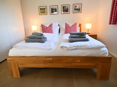 Ein Bett oder Betten in einem Zimmer der Unterkunft FEWO RISSERKOGEL das Original mit großem Garten