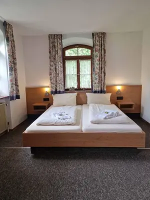 Ein Bett oder Betten in einem Zimmer der Unterkunft Pension Benedikt
