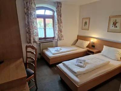 Ein Bett oder Betten in einem Zimmer der Unterkunft Pension Benedikt