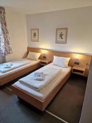Ein Bett oder Betten in einem Zimmer der Unterkunft Pension Benedikt