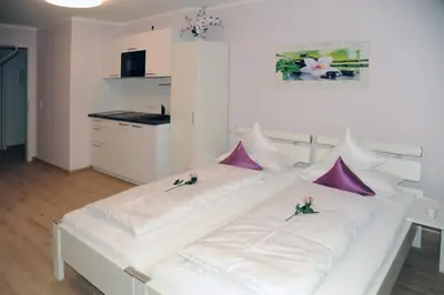 Ein Bett oder Betten in einem Zimmer der Unterkunft Pension Lerchenfeld