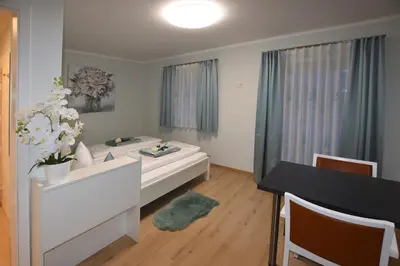 Ein Bett oder Betten in einem Zimmer der Unterkunft Pension Lerchenfeld