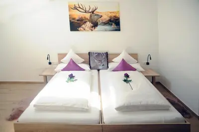 Ein Bett oder Betten in einem Zimmer der Unterkunft Pension Lerchenfeld