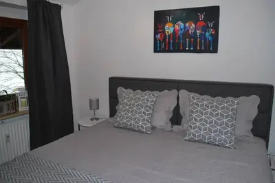 Ein Bett oder Betten in einem Zimmer der Unterkunft Sonniges Appartement am Tegernsee