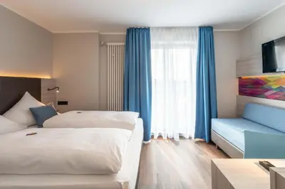 Ein Bett oder Betten in einem Zimmer der Unterkunft Westend Hotel (non-smoking)