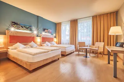 Ein Bett oder Betten in einem Zimmer der Unterkunft AKZENT Hotel Aufkirchen