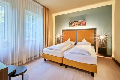 Ein Bett oder Betten in einem Zimmer der Unterkunft AKZENT Hotel Aufkirchen