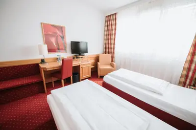 Ein Bett oder Betten in einem Zimmer der Unterkunft Feringapark Hotel by Coffee Fellows Hotels