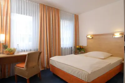 Ein Bett oder Betten in einem Zimmer der Unterkunft Hotel Amba