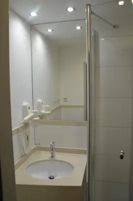 Ein Badezimmer in der Unterkunft Hotel Amba