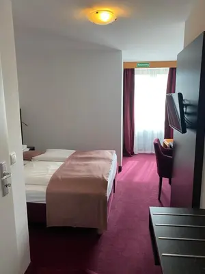 Ein Bett oder Betten in einem Zimmer der Unterkunft Hotel Montree