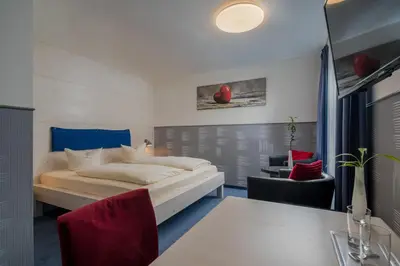 Ein Bett oder Betten in einem Zimmer der Unterkunft Hotel Fidelio