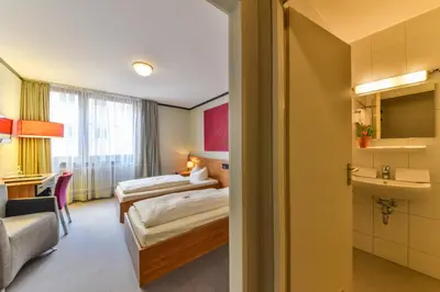 Ein Bett oder Betten in einem Zimmer der Unterkunft Hotel Fidelio