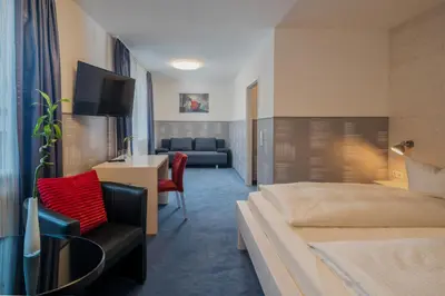 Ein Bett oder Betten in einem Zimmer der Unterkunft Hotel Fidelio