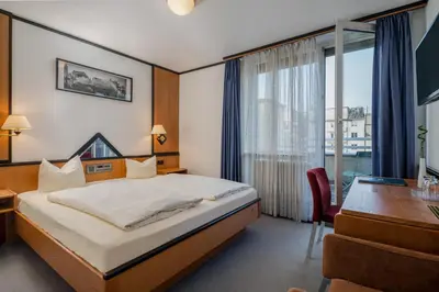 Ein Bett oder Betten in einem Zimmer der Unterkunft Hotel Fidelio