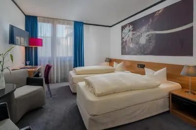 Ein Bett oder Betten in einem Zimmer der Unterkunft Hotel Fidelio