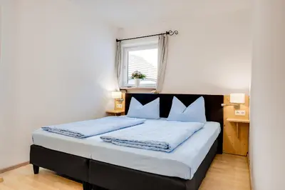 Ein Bett oder Betten in einem Zimmer der Unterkunft Gästehaus u Ferienwohnungen Veronika incl Frühstücksbuffet und KönigsCard mit 200 kostenlosen Attraktionen