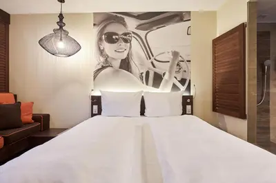 Ein Bett oder Betten in einem Zimmer der Unterkunft Hotel GIO