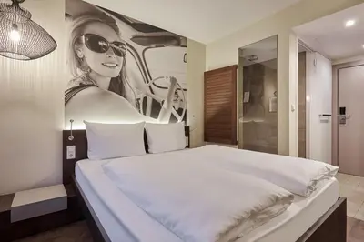 Ein Bett oder Betten in einem Zimmer der Unterkunft Hotel GIO