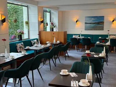 Ein Restaurant oder anderes Speiselokal in der Unterkunft K+K Hotel am Harras