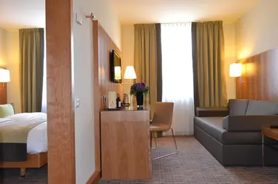 Ein Bett oder Betten in einem Zimmer der Unterkunft K+K Hotel am Harras
