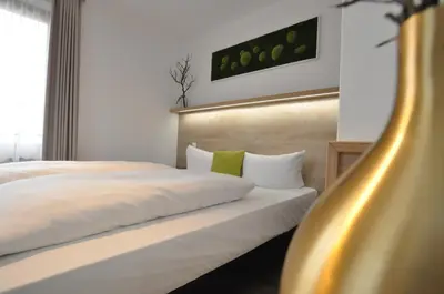 Ein Bett oder Betten in einem Zimmer der Unterkunft Hotel Perlach Allee by Blattl
