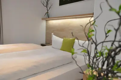 Ein Bett oder Betten in einem Zimmer der Unterkunft Hotel Perlach Allee by Blattl