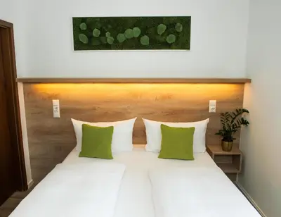Ein Bett oder Betten in einem Zimmer der Unterkunft Hotel Perlach Allee by Blattl