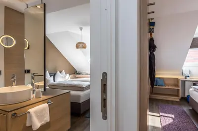 Ein Bett oder Betten in einem Zimmer der Unterkunft Bavaria Boutique Hotel