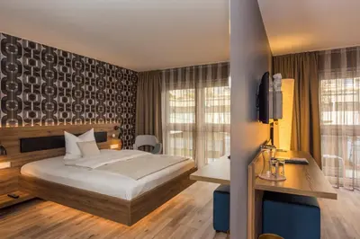 Ein Bett oder Betten in einem Zimmer der Unterkunft Bavaria Boutique Hotel