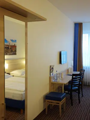 Ein Bett oder Betten in einem Zimmer der Unterkunft AMBER ECONTEL