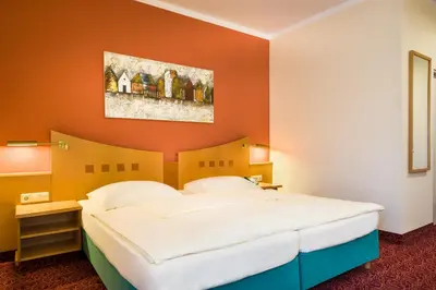 Ein Bett oder Betten in einem Zimmer der Unterkunft Mercure Hotel Ingolstadt