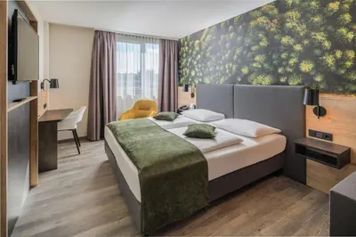Ein Bett oder Betten in einem Zimmer der Unterkunft Best Western Hotel München Airport