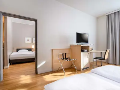 Ein Bett oder Betten in einem Zimmer der Unterkunft Mövenpick Hotel München-Airport