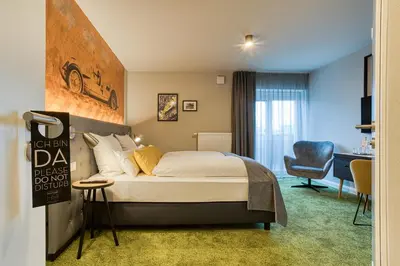 Ein Bett oder Betten in einem Zimmer der Unterkunft Vienna House Easy by Wyndham Ingolstadt