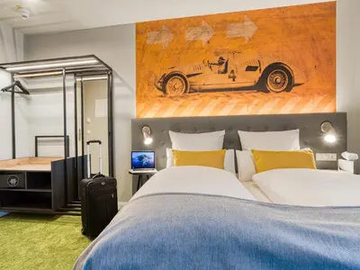 Ein Bett oder Betten in einem Zimmer der Unterkunft Vienna House Easy by Wyndham Ingolstadt