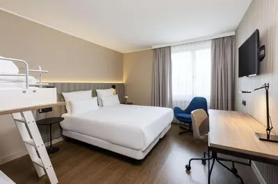 Ein Bett oder Betten in einem Zimmer der Unterkunft NH München Airport