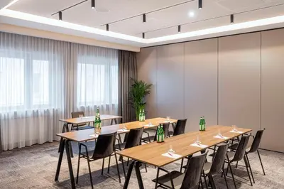 Ein Restaurant oder anderes Speiselokal in der Unterkunft NH Collection München Bavaria