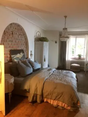 Ein Bett oder Betten in einem Zimmer der Unterkunft Pension Chapeau