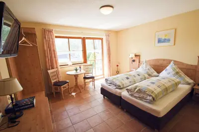 Ein Bett oder Betten in einem Zimmer der Unterkunft Stefanutti-Hof