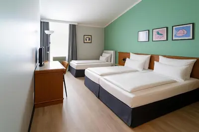 Ein Bett oder Betten in einem Zimmer der Unterkunft Garner Hotel Munich - Messe by IHG