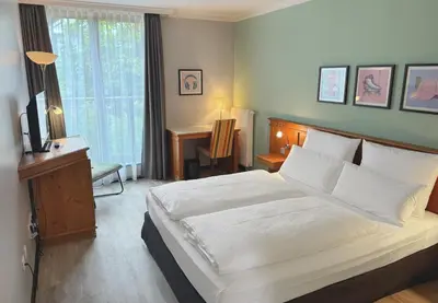 Ein Bett oder Betten in einem Zimmer der Unterkunft Garner Hotel Munich - Messe by IHG
