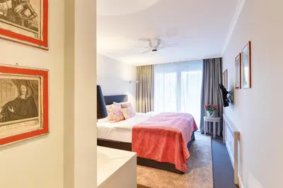 Ein Bett oder Betten in einem Zimmer der Unterkunft Hotel Admiral