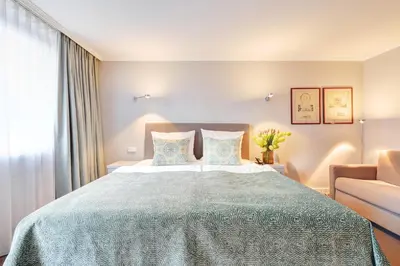 Ein Bett oder Betten in einem Zimmer der Unterkunft Hotel Admiral